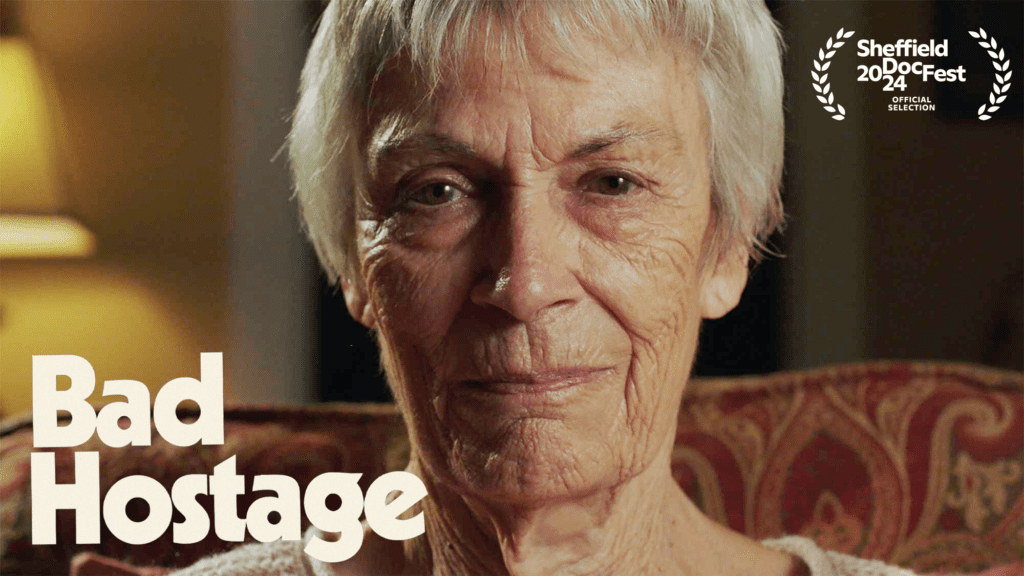 A promo image for the Stockholm Syndrome film "Bad Hostage" featuring an older woman staring directly into the camera.